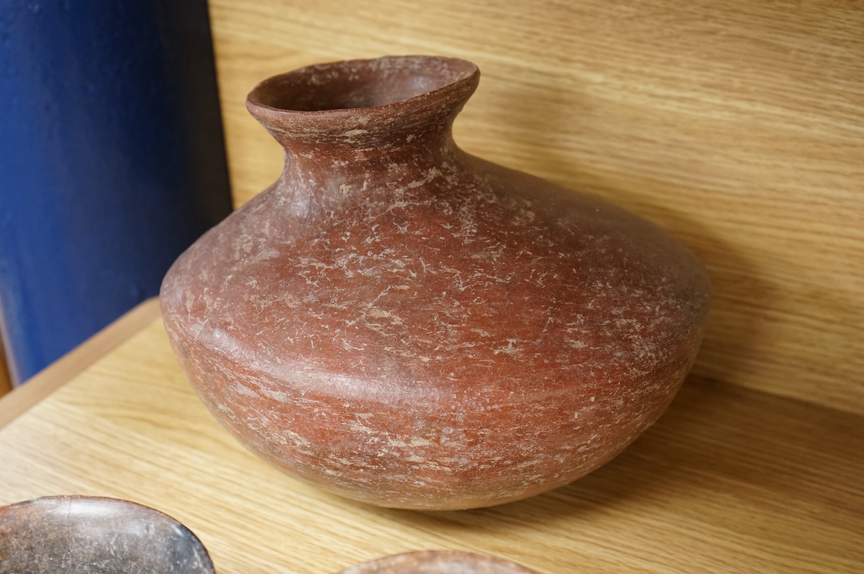 A collection of various South American vessels some in the form of grotesque heads, largest 24cm wide